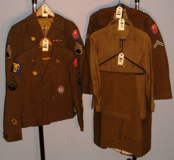WWII US Army Grouping: WWII US Army grouping (5 pcieces) including European Theater 2 IKE jackets, overcoat, pants and shirt with all insignia