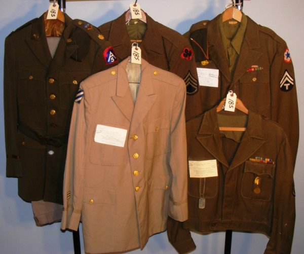 WWll Uniform Grouping: WWll Uniform grouping including a long blouse, IKE jacket, 2 hats, pants and lots of Insignia (some identified)