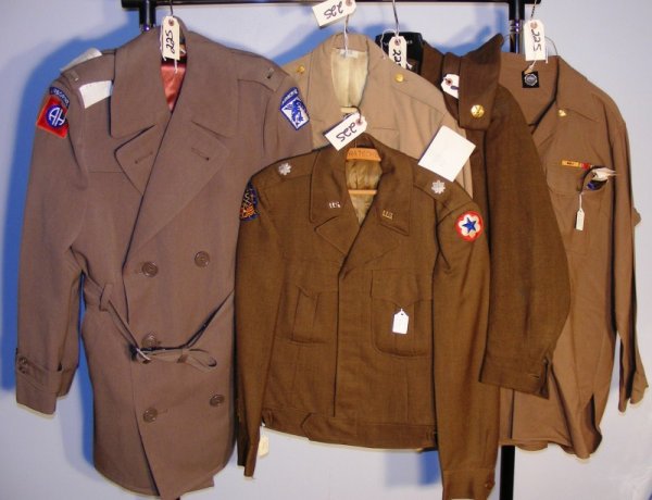 WWII US Army Uniforms: WWII US Army uniforms including 4 jackets, 1overcoat1 shirt some w/ insignia and patches.