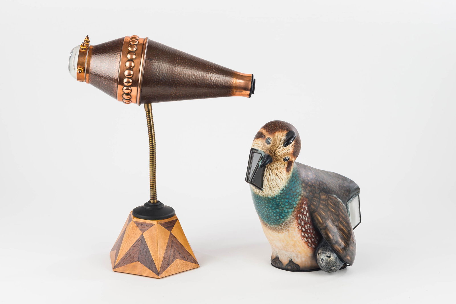 Danny Curry Figural Kaleidoscopes (2): The first is a Danny Curry kaleidoscope created from re-purposed objects. It has a copper tone body on a flexible rod with marquetry inlaid base. It is fully functional and is missing one protrusion o