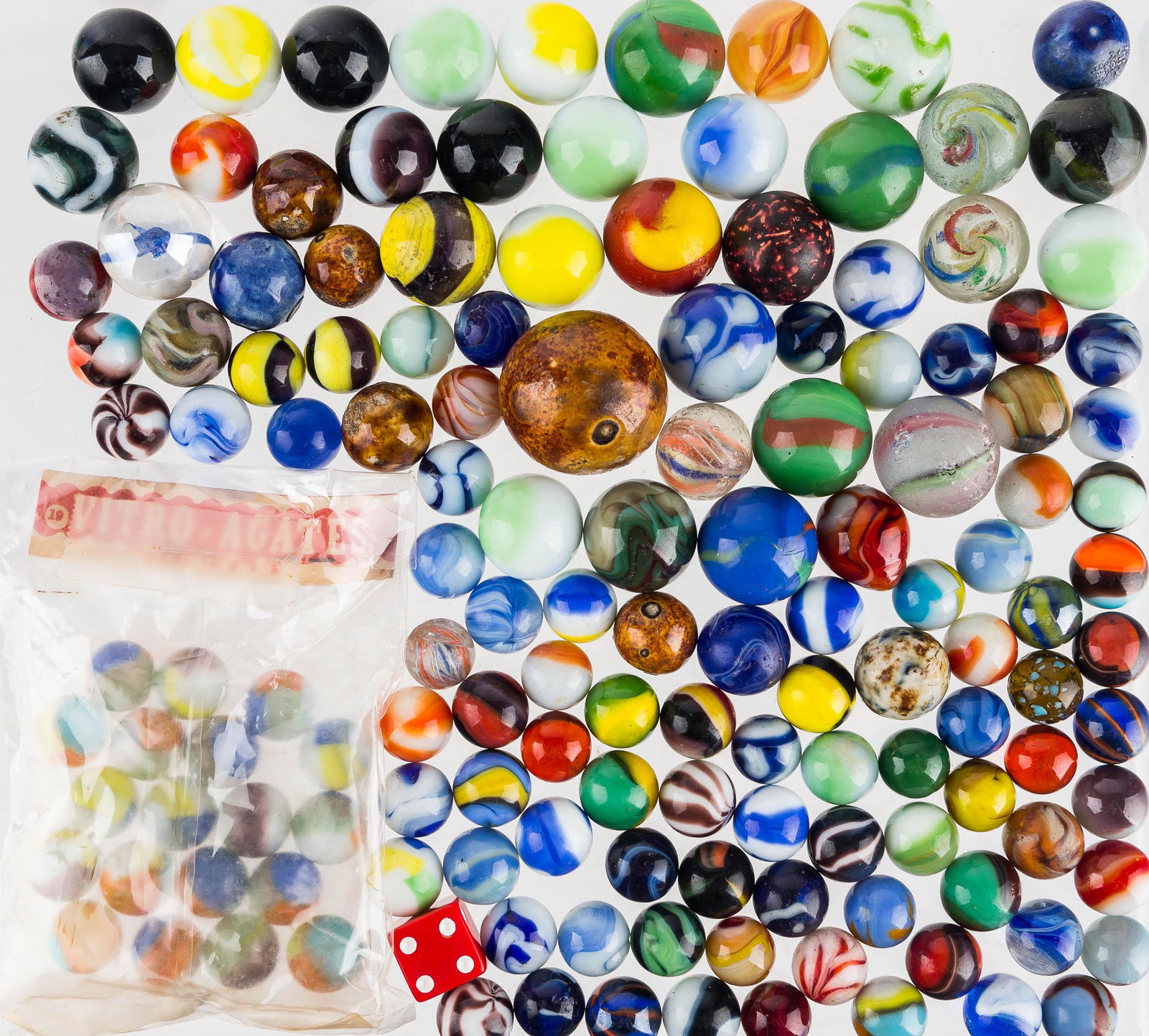 Latticino Swirl & Other Mixed Marbles: There are (5) latticino swirl marbles of various sizes, all in need of tumbling; a clay super-knuckler; high quality striped marbles, bumblebees, agates, and others.