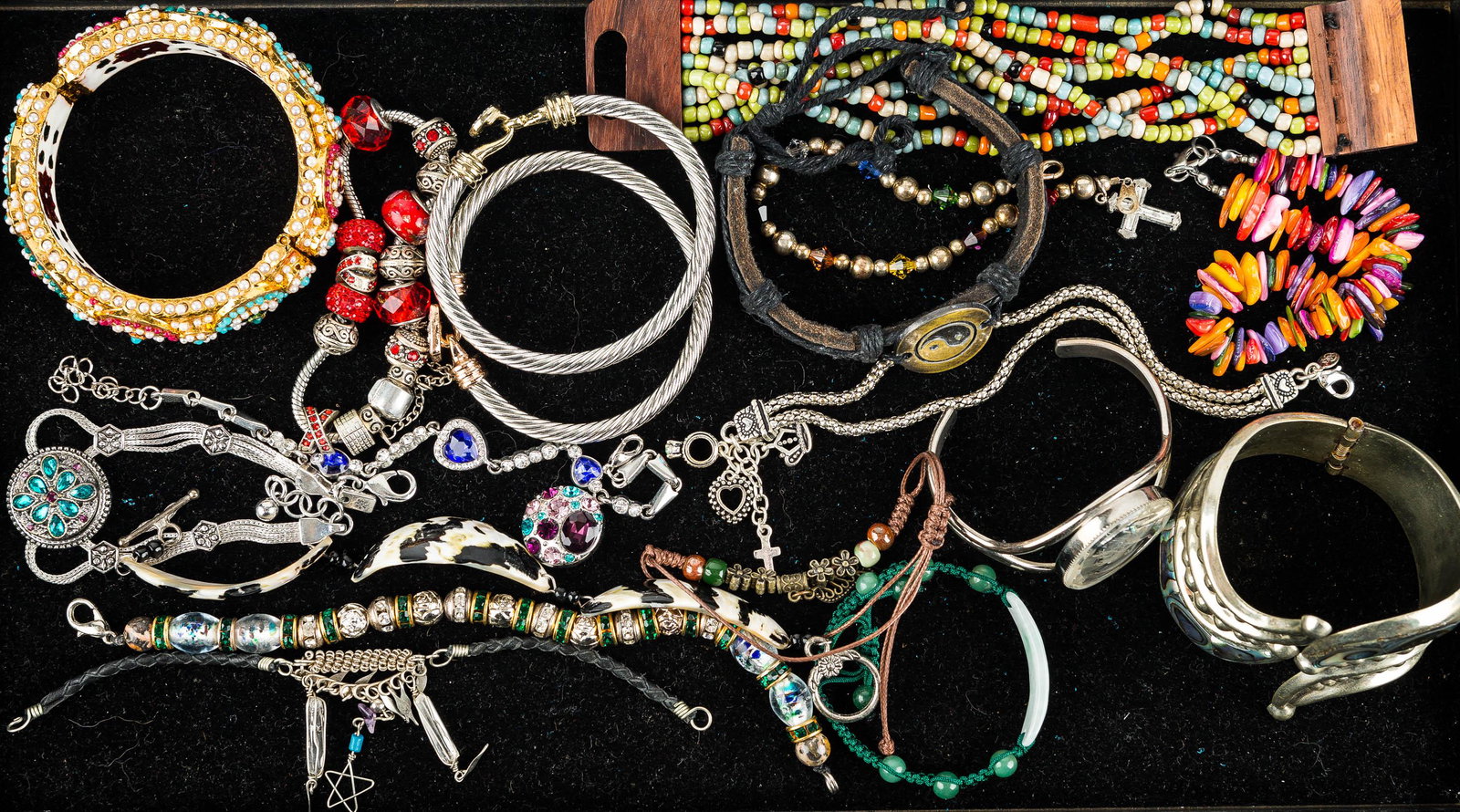 Cuff Bracelets & Other Jewelry: a large Alpaca hinged cuff with abalone inlay, ornate cuff with beaded exterior and enameled interior, cuff with reverse cut cameo, various rope style cuffs, a heart bracelet with blue and clear rhine