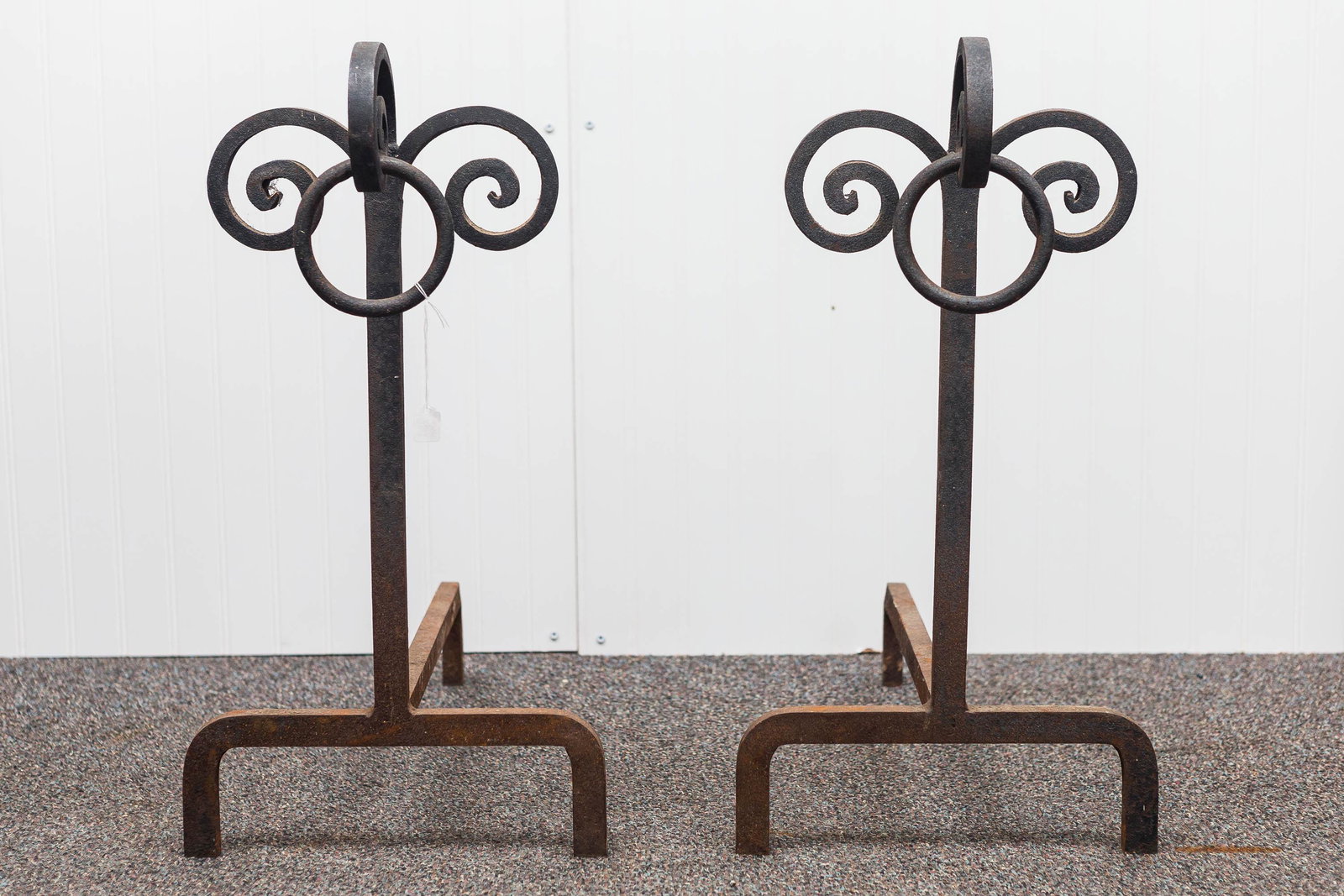 Large Arts & Crafts Andirons (Matched Pair): These matching, antique, triple-scroll Arts and Crafts andirons have large bull rings, and each measures approx. 24" H x 22" D. Both are free of visible damage.