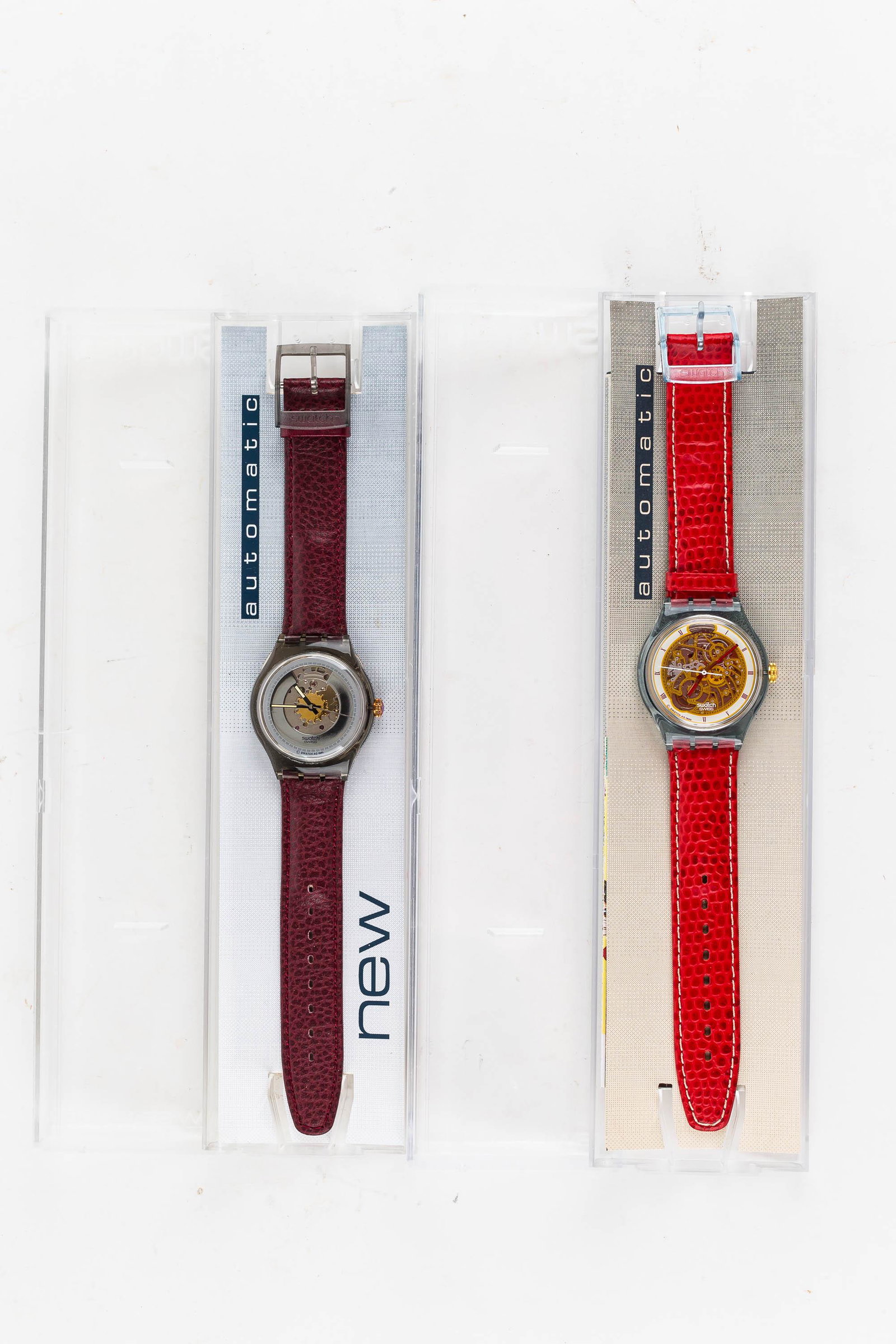 Swiss Skeletal Swatch Watches (2): There are (2) Swatch automatic skeletal watches, both in original case.