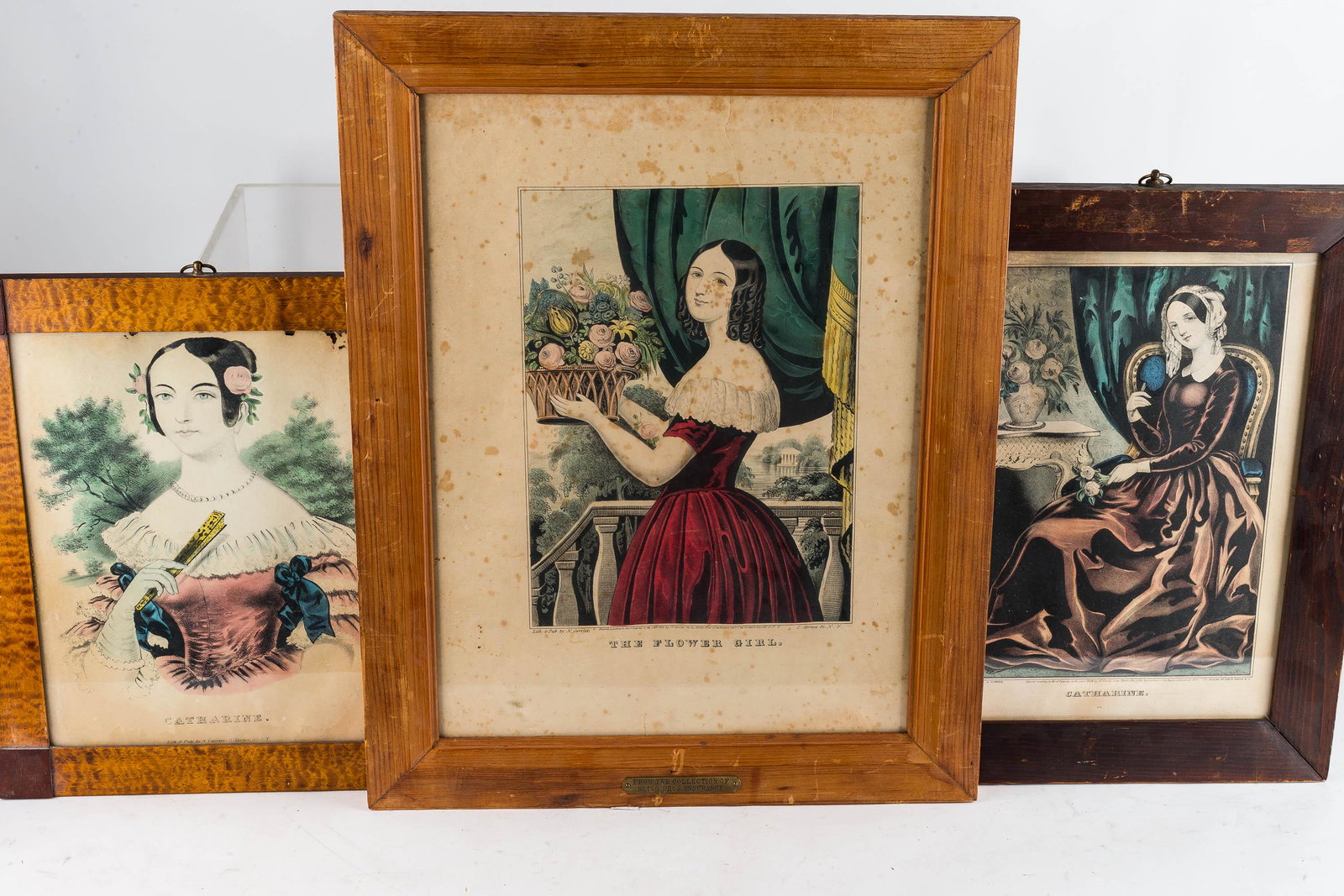 Hand-Painted Female Portraits- Currier & Ives: This lot of hand-colored lithographs by Currier & Ives includes (2) portraits titled "Catharine", one with curly maple veneer frame and silverfish damage near top. Lot also includes "The Flower Girl" 