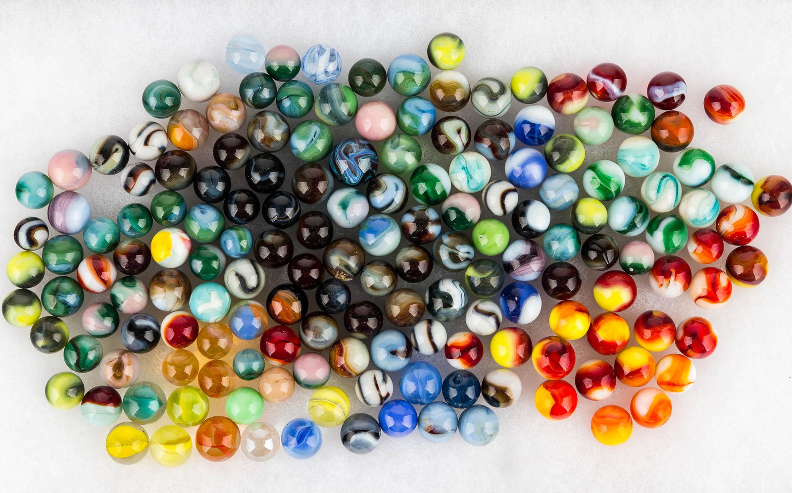 Akro Agate & Other Marbles: selection of akro agate, cat's eye, and other marbles of various styles.