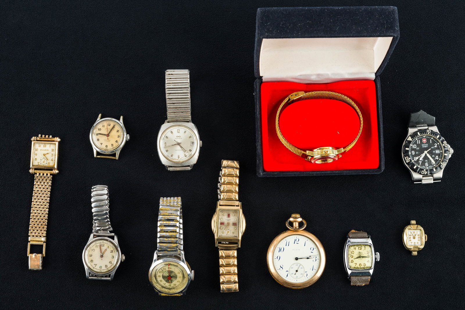 Vintage Pocket & Wristwatches: a vintage Elgin gold tone pocketwatch marked "Mary Belle to George 1913", case #8543588, movement #16987830 (watch is missing glass bezel. Lot also includes a Cort wristwatch as found, a Test men's wr