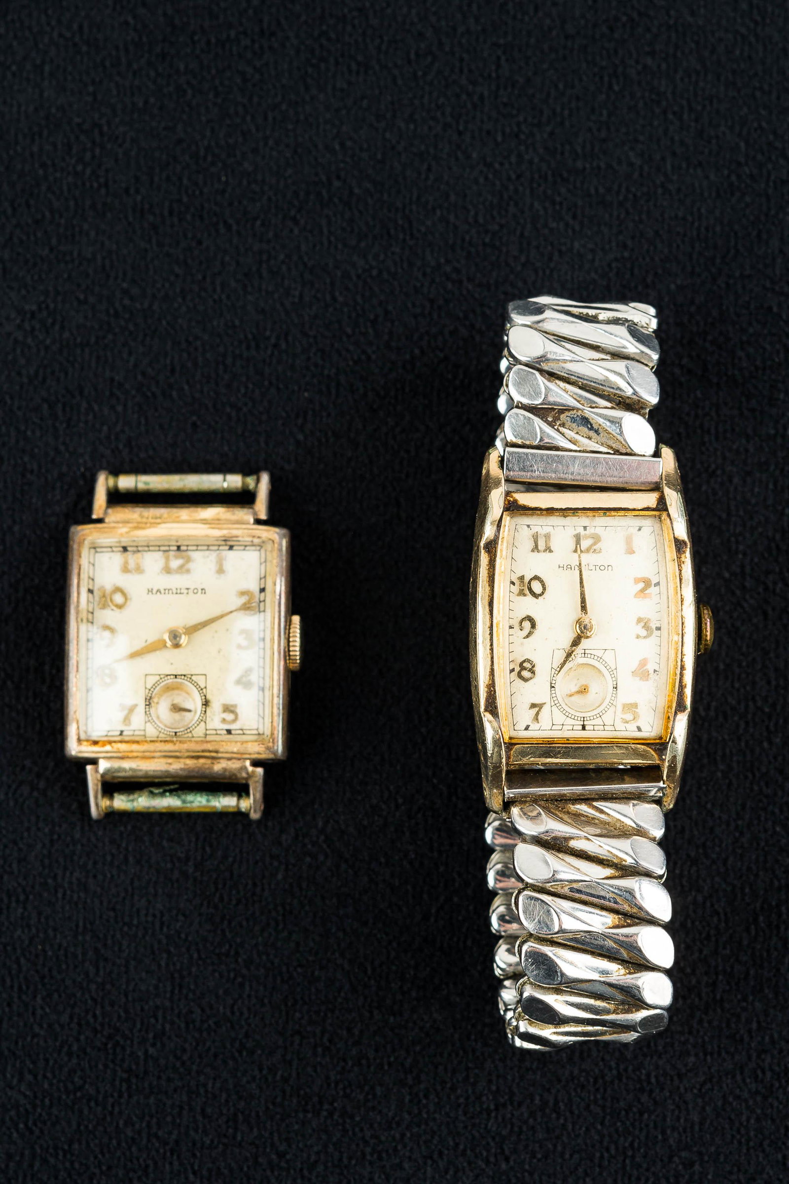 Vintage Hamilton Wristwatches (2): (2) 1940s watches with second-hand dials. There is a rectangular Hamilton 19 jewel watch with gold fill body and stainless band (currently running, but not guaranteed & showing common wear). Lot also 