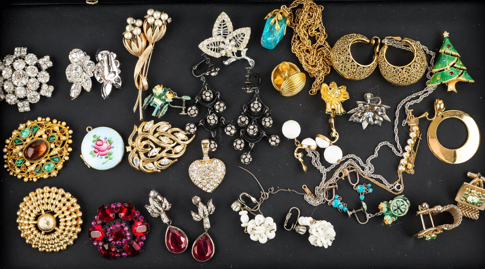 Quality Brooches & Mixed Earrings: a gold tone brooch with multi-colored rhinestones and faux pearls with obscure maker's mark measuring approx. 2"; a gold tone brooch with aurora crystals marked "Trifari"; a snowflake brooch with larg