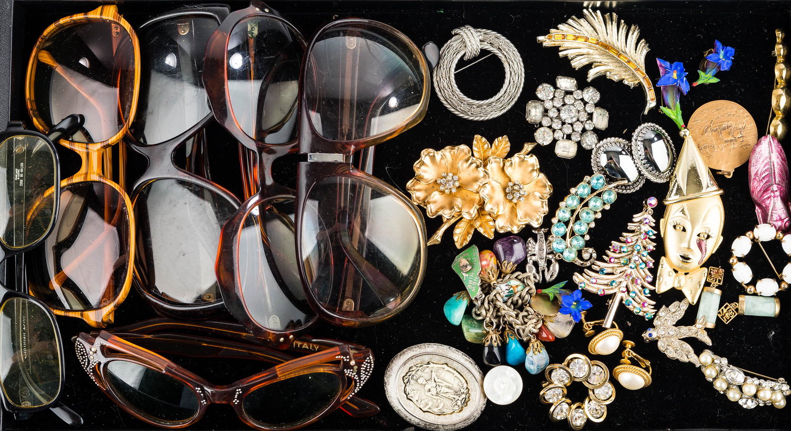 Mod Sunglasses & Costume Jewelry: many vintage sunglasses and eyeglasses. There is a pair of cat's eye retro sunglasses marked "Italy", a pair of Twiggy style sunglasses marked "France", a pair of Christian Dior eyeglasses, and other 