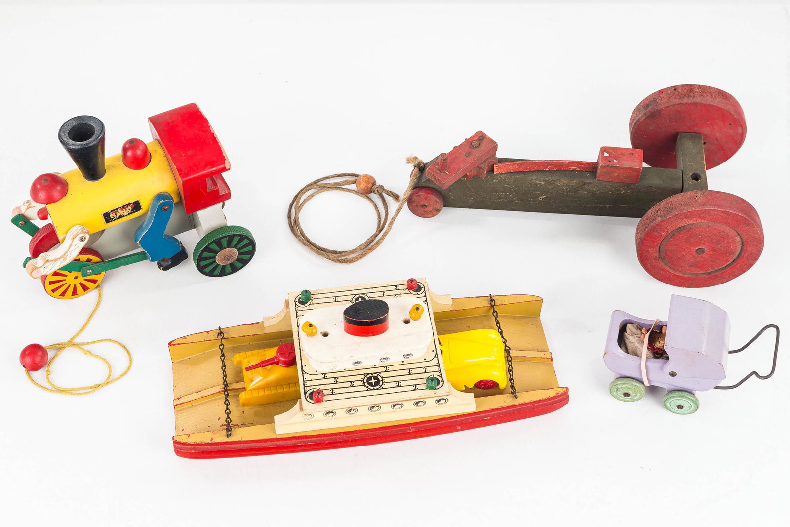 Vintage Wooden Toy Grouping: This vintage grouping includes a wooden Brio train, a wooden ship with plastic tank, a wooden baby buggy, and a wooden clicking pull tractor.