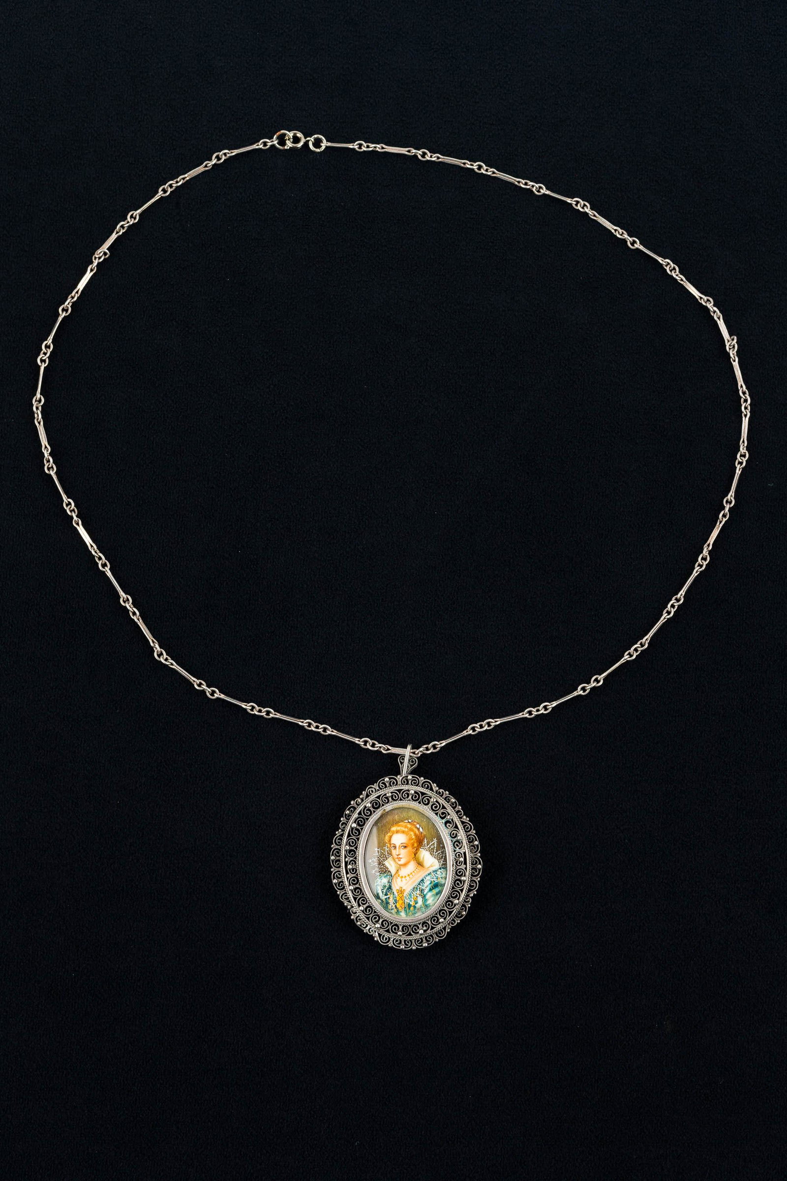 Vintage Silver Portrait Necklace: This .800 silver brooch/pendant features a hand-painted Elizabethan lady on sterling silver chain.