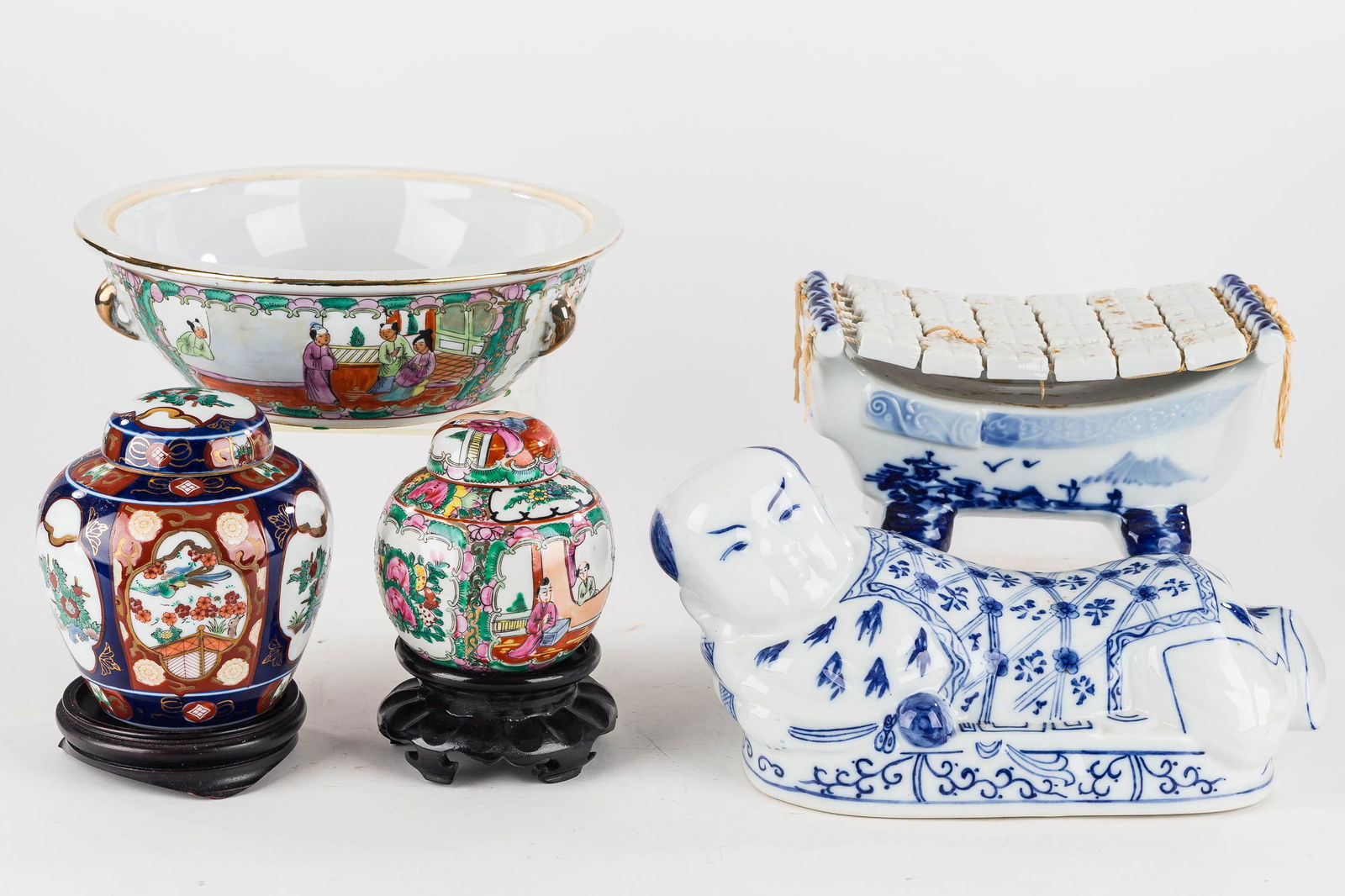 Mixed Asian Ceramics: (2) ginger jars; the larger is marked "Gold Imari", and the second is marked "Made in Japan, Decorated in Hong Kong." Lot also includes a large Asian bowl with no lid, a figural opium pillow measuring