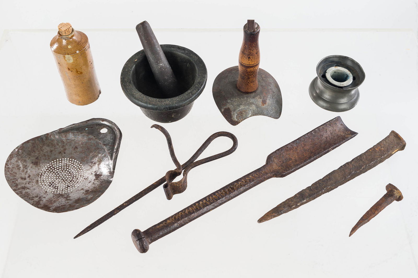 19th C Kitchenware and Tools: a hog scraper, a cast mortar with stone pestle, a small stoneware vessel with chips at base, a pewter inkwell, and a selection of early tools.