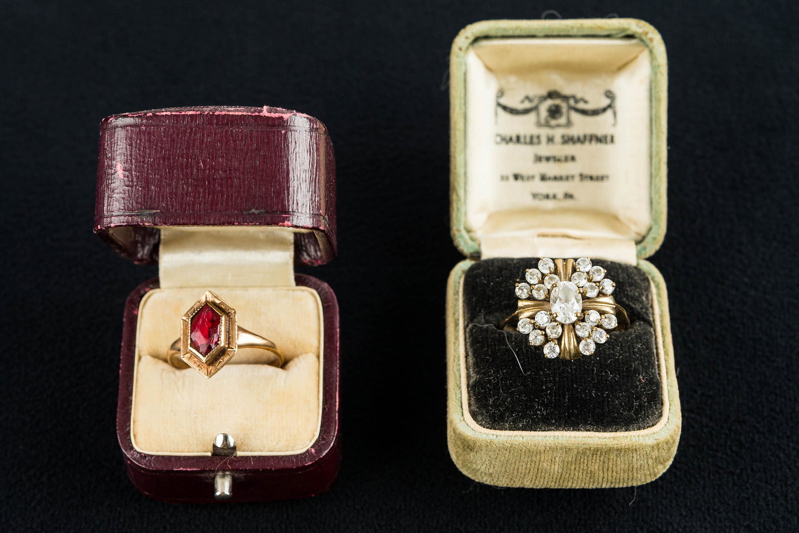 Victorian 10k Gold Ladies' Rings (2): This lot includes a ring marked .333 for 8k gold with rhinestones, approx. size 10.25; and a 10k gold ladies' ring with damaged ruby, approx. size 8.25. Both come with ring boxes and the total weight