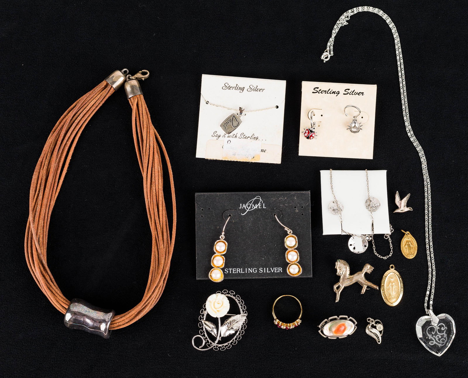 Mixed Sterling Silver Jewelry: Collection includes earrings, necklace with etched crystal pendant, pins with sterling frames, and other sterling silver jewelry.
