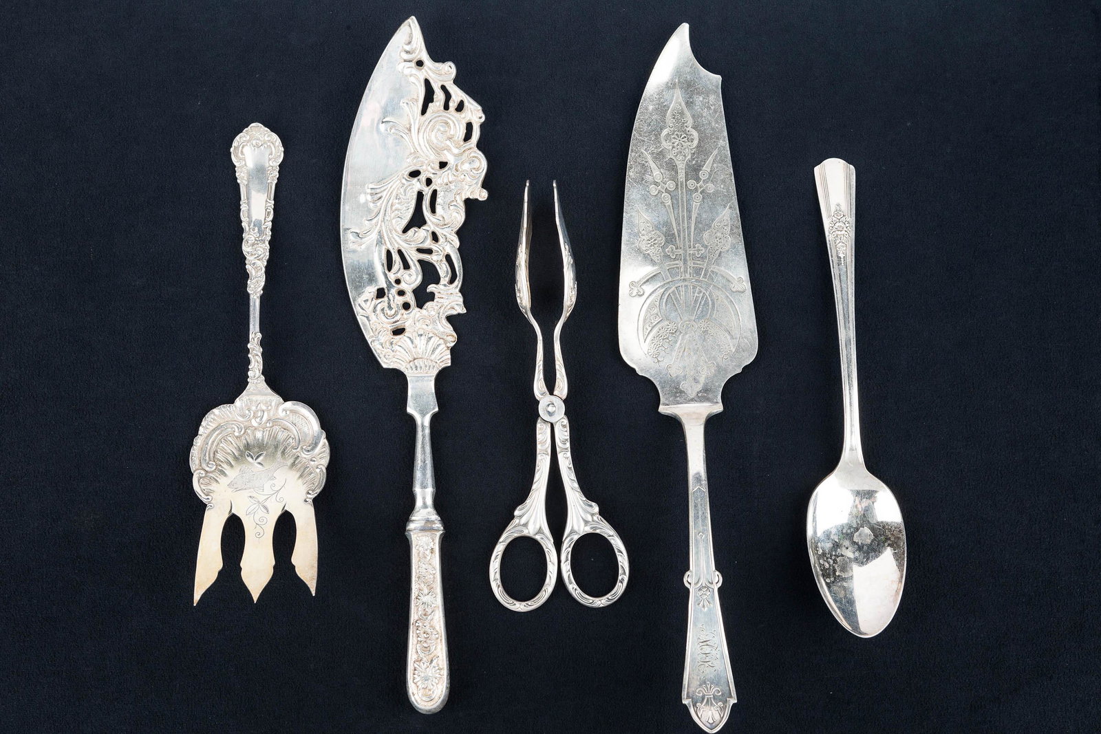 Stylized Victorian Silver Plate Serving Pieces: This Victorian group includes (2) fish servers (12"L), one with elaborate reticulation in a fish design, and the other with an etched geometric design; both are marked "Patented March 14 1871, Reed & 