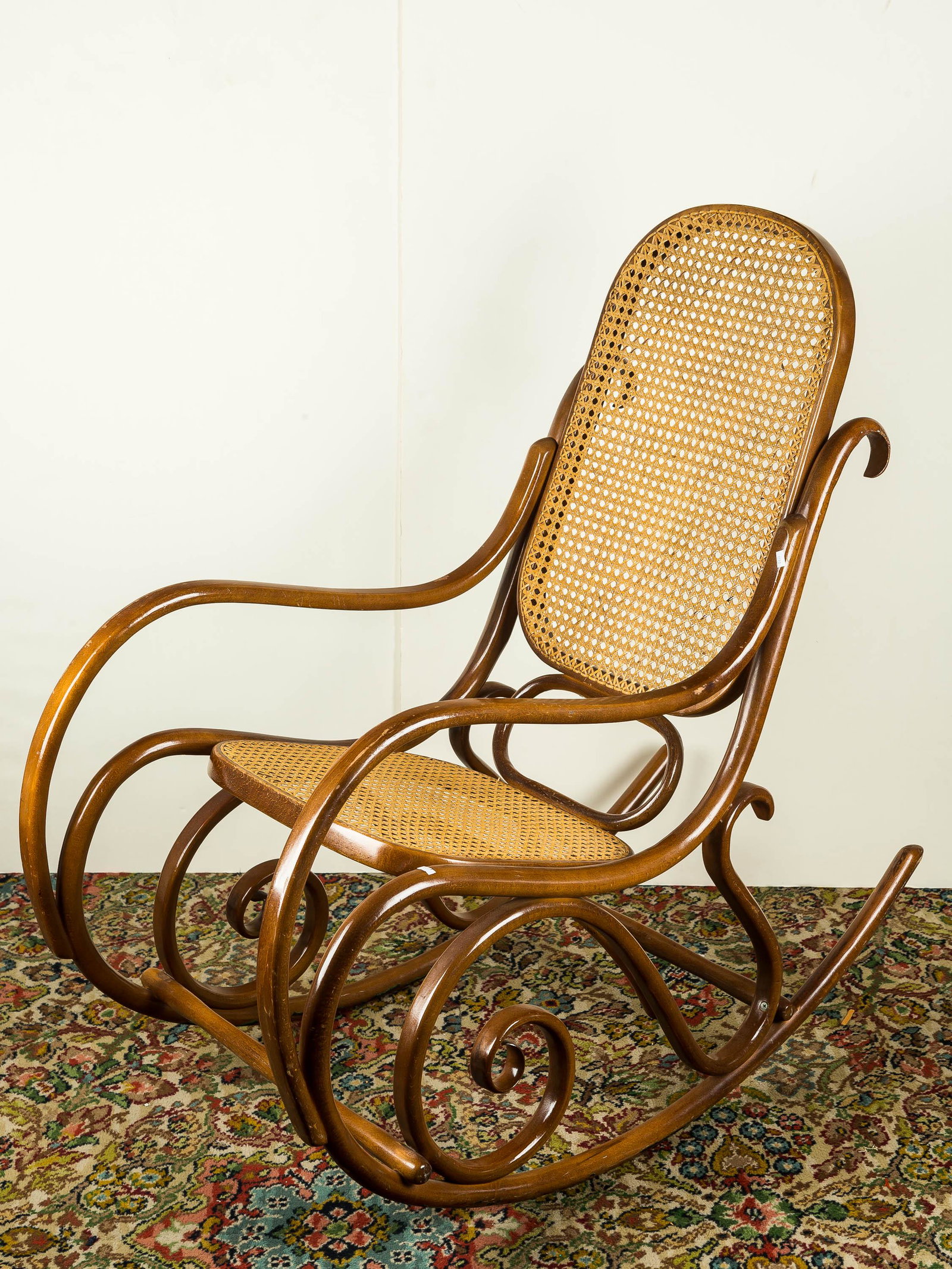 Thonet Rocking Chair: This genuine Thonet rocking chair is bentwood and in good condition with cane seat.