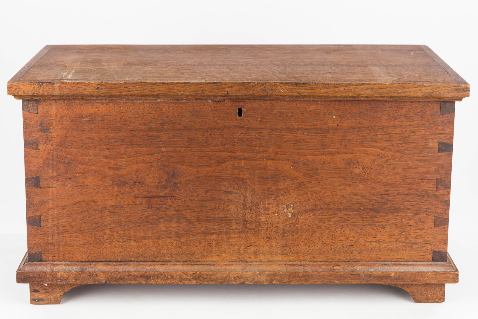 Miniature PA Dovetailed Blanket Chest: Chest is walnut with hand-dovetailed construction. It has an interior till and measures approx. 10"H x 19"W x 9"D.