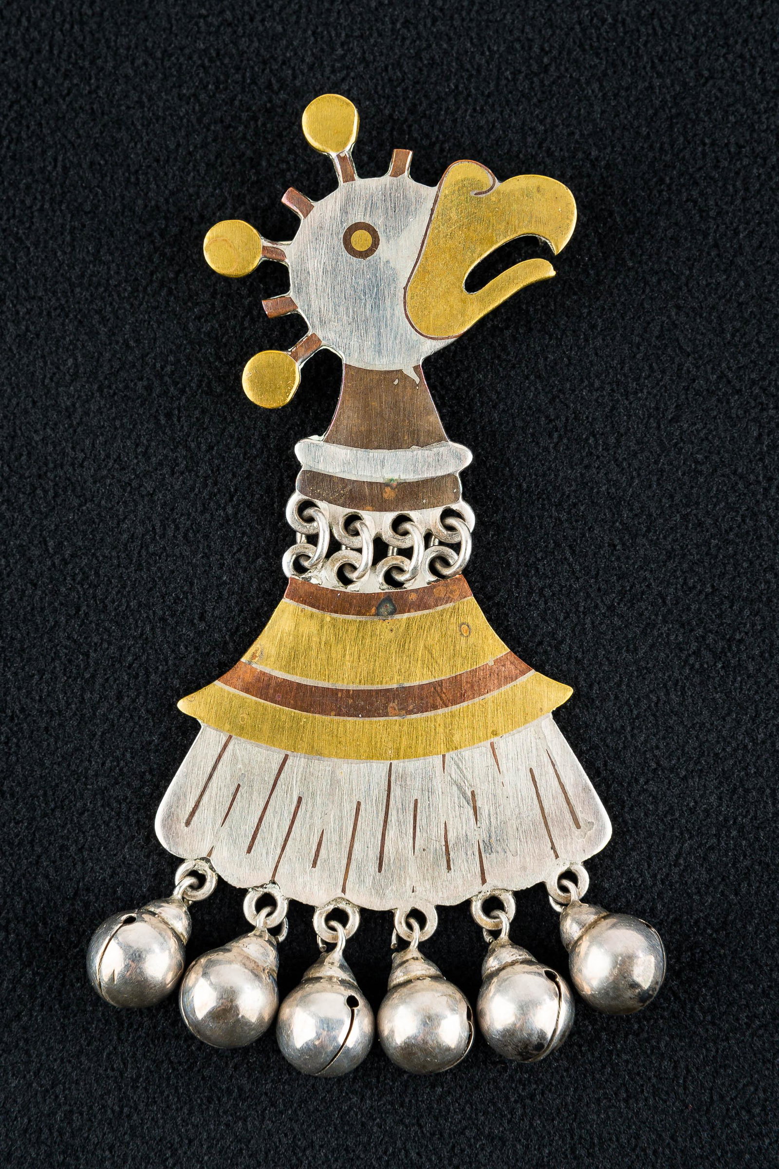 Rare Los Castillo Vintage Mixed-Metal Brooch: This unique signed Los Castillo brooch is marked "Los Castillo, Taxco 22 Metales Castillo, Made in Mexico". It is has a reticulated design of sterling silver, copper, and brass depicting an eagle with