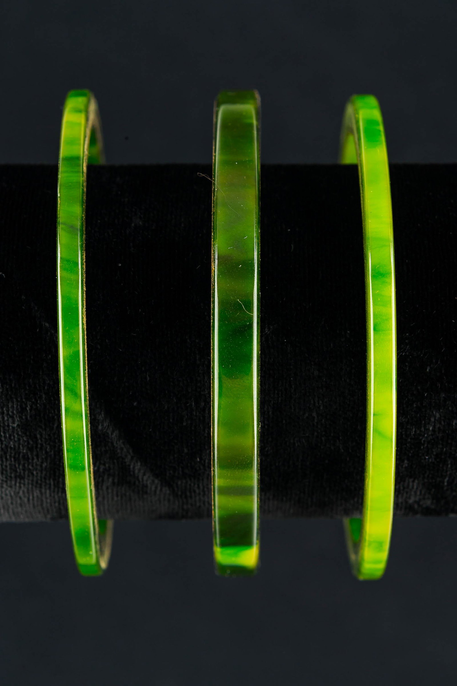 Bakelite Vintage Bracelets (3): This collection of (3) bright, mottled green bangle bracelets have been tested for Bakelite and are free of damage. Each measures approx. 3" O.D./outside diameter.
