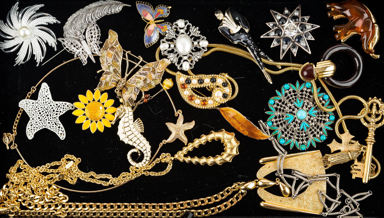 Mixed Vintage & Other Figural Jewelry: This figural collection includes a Trifari seahorse enamel brooch, a Lisner signed white starfish brooch, several butterfly, gold tone, turquoise style and other brooches, and necklace, earrings, and