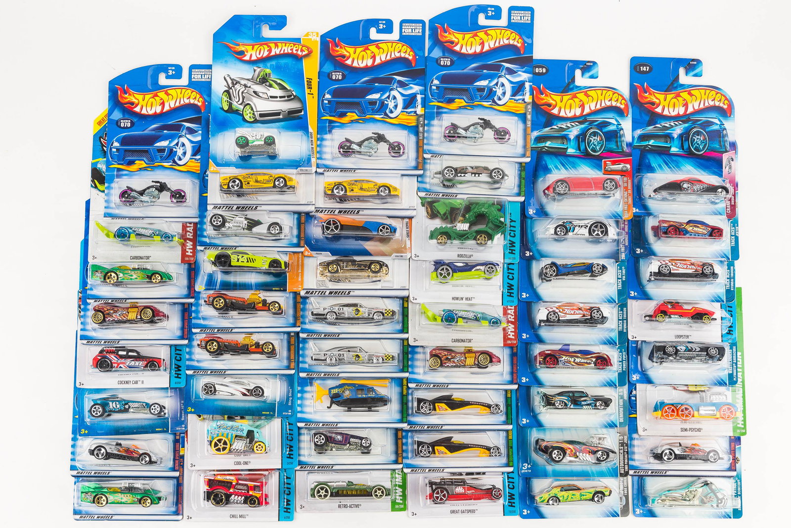 Hot Wheels New on Hang Card (50): There are (50) Hot Wheels, all NIP, with packs dated 2003, 2013, 2000, and other mixed dates.