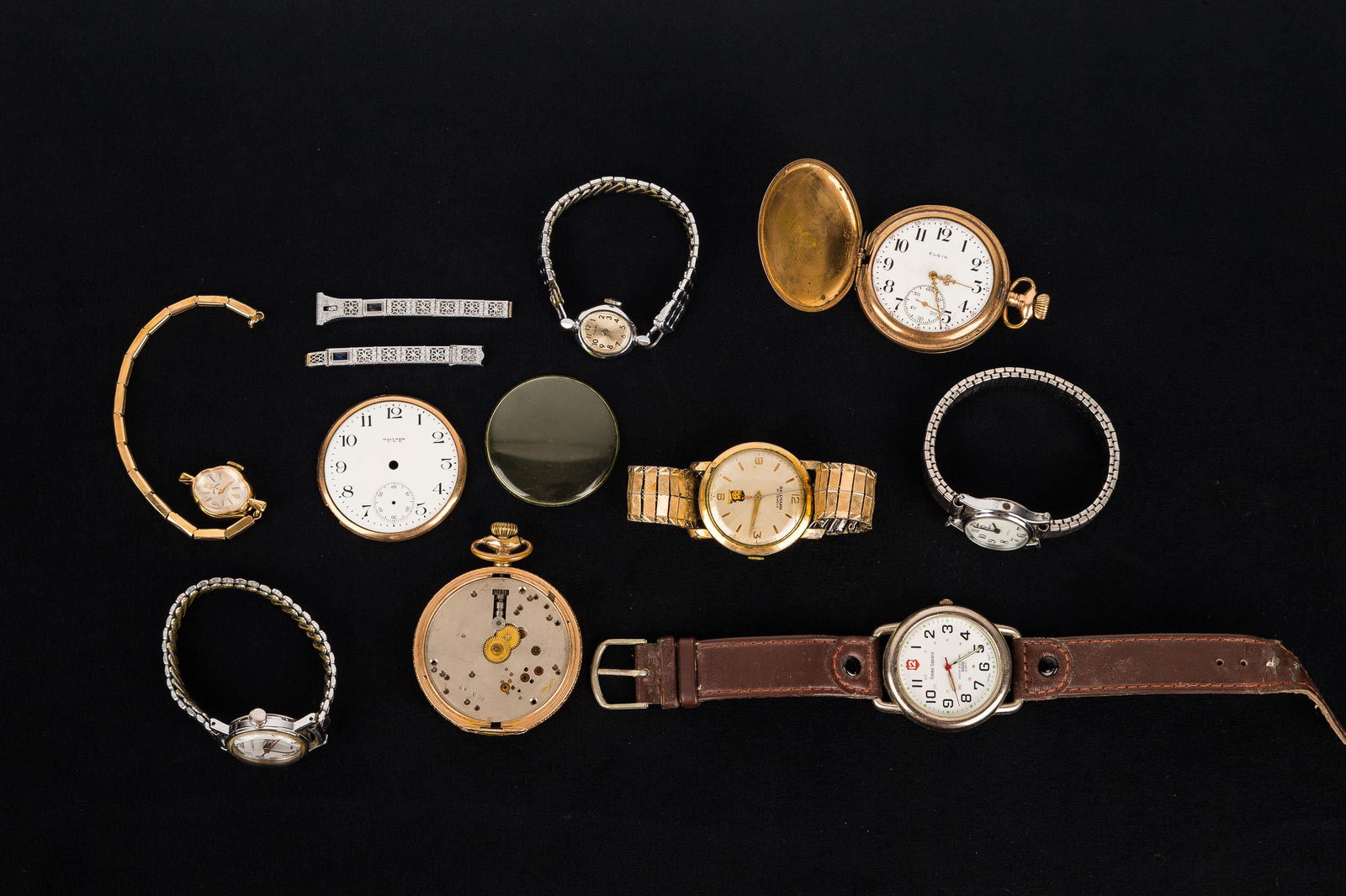 Vintage Wrist & Pocket watches: Watches include an Elgin 15-jewel pocket watch in hunt case (missing bezel) Case #6125485, Movement #18797472; a Hallmark 21-jewel wristwatch with Native American child figure on face, a vintage ladie