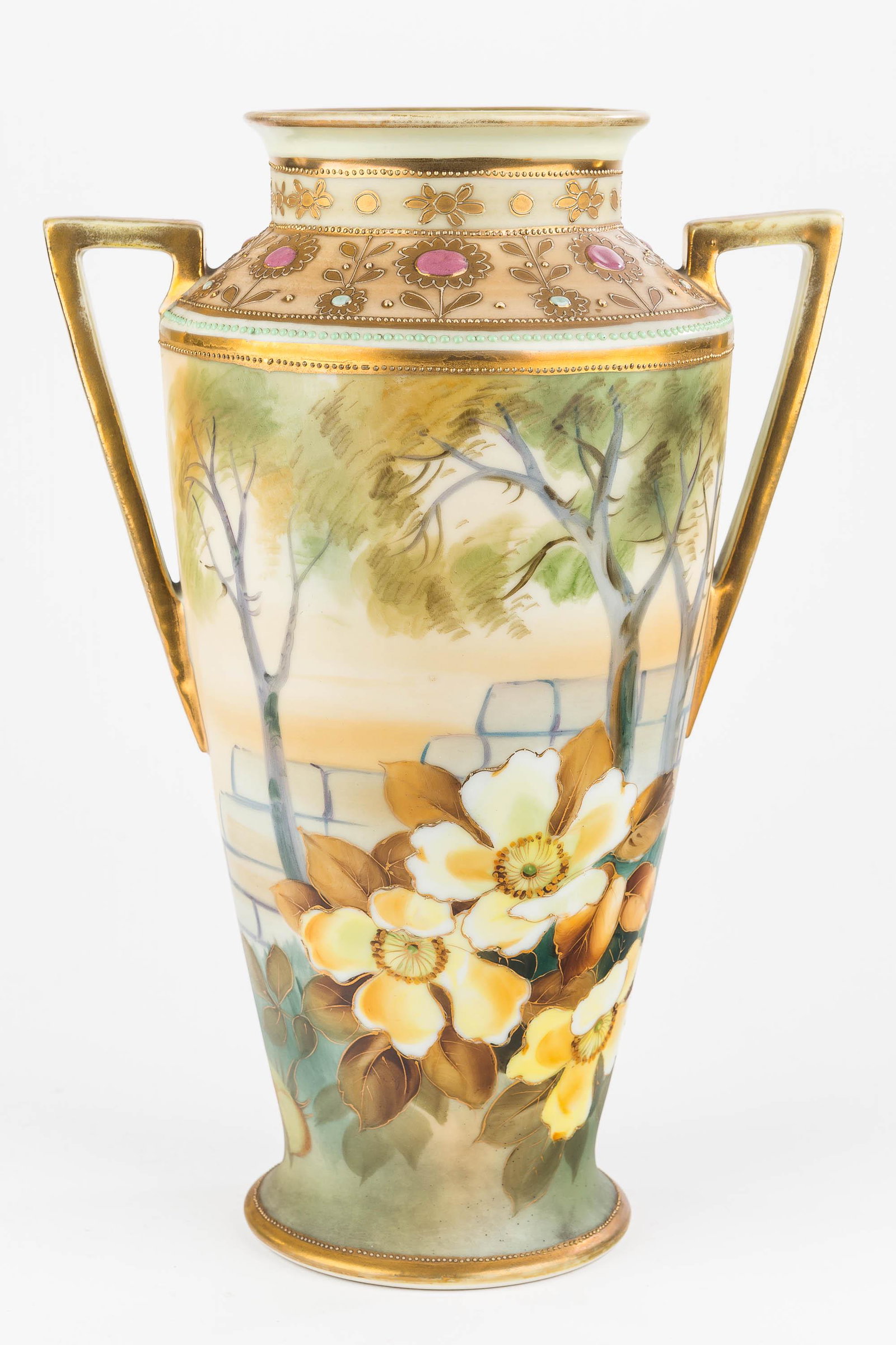Hand-Painted Nippon Vase: This two-handled Nippon vase has hand-painted trees and flowers (handles show wear to gold flashing). Vase measures approx. 10.5"H.