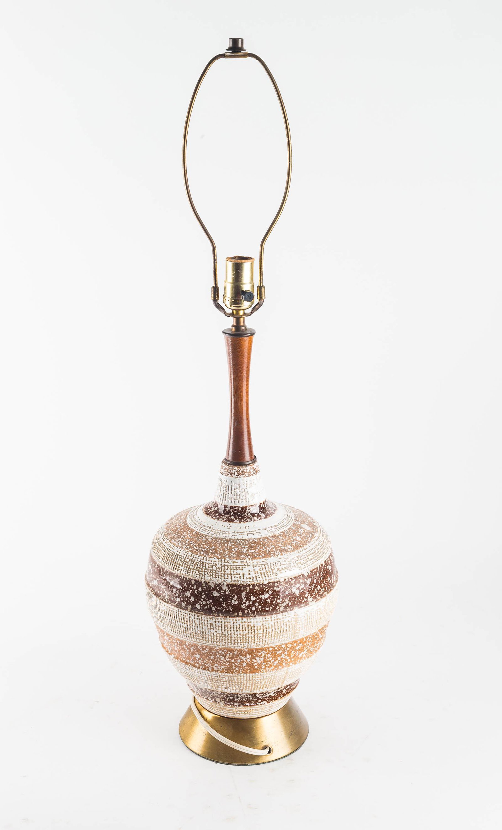 Mid Century Modern Table Lamp: It is brass, ceramic and wood construction with a three tone coloration, has been rewired and works. It is approx 32" to top of harp, 21" diameter.