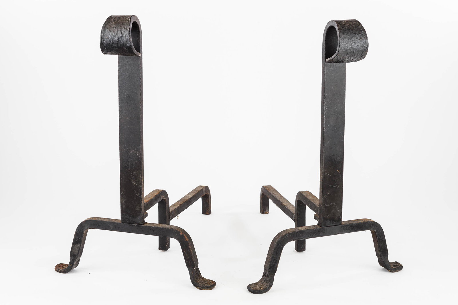 Arts and Crafts Style Iron Andirons: They have a wrought iron finial and date to the mid 20th C. 16.5" H x 11" W x 15" D.