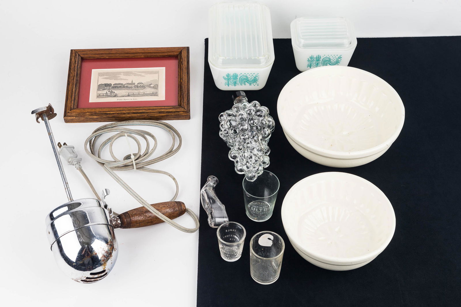 Vintage Kitchenware and Advertising: Early to mid 20th C kitchenware with two lidded Pyrex refrigerator dishes, the largest approx 7.75" W, an Eskimo kitchen mixer / milk shake blender, a screw top glass flask in the shape of a bunch of