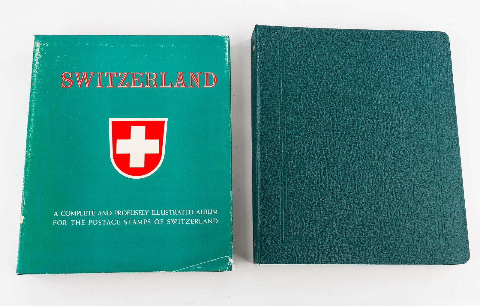 Two Switzerland Stamp Albums: First album is approx. 80% full. Includes stamps from mid 19th century. Second album is approx. 80 % full and includes newer stamps.