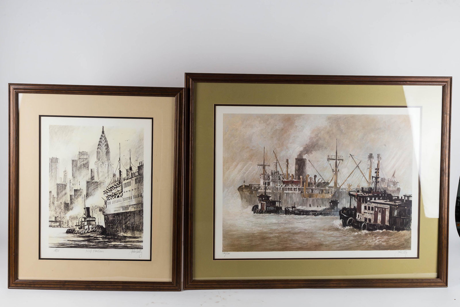 John Kelly Color Lithographs: Larger lithograph measures 22 X 30, inner dimensions of matting. Signed and numbered 290 of 500 and titled The Harbor. Smaller lithograph has a measurement of 25" X 16". Signed and numbered 40 of 275,
