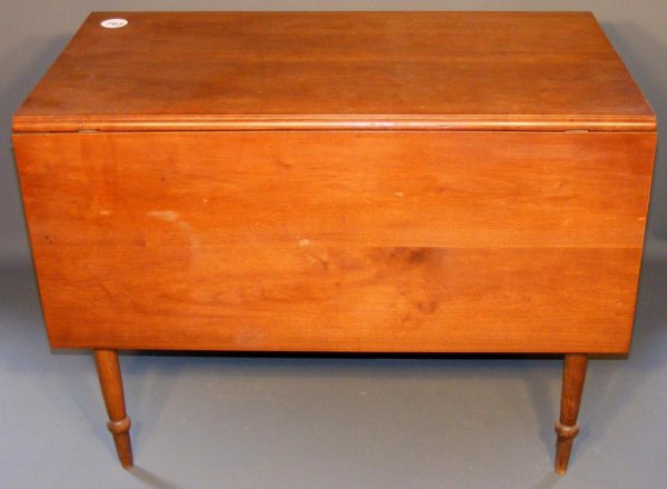 Cherry Drop Leaf Table: Cherry Drop Leaf Table w/ tapered legs. 29-1/2"h x 39"w, 22-1/4" closed, 52-1/4" open