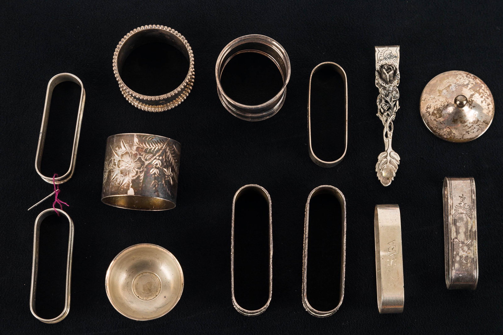 Sterling Napkin Rings: Ten silver napkin rings, 925 tongues and a sterling little pot approx 210 grams