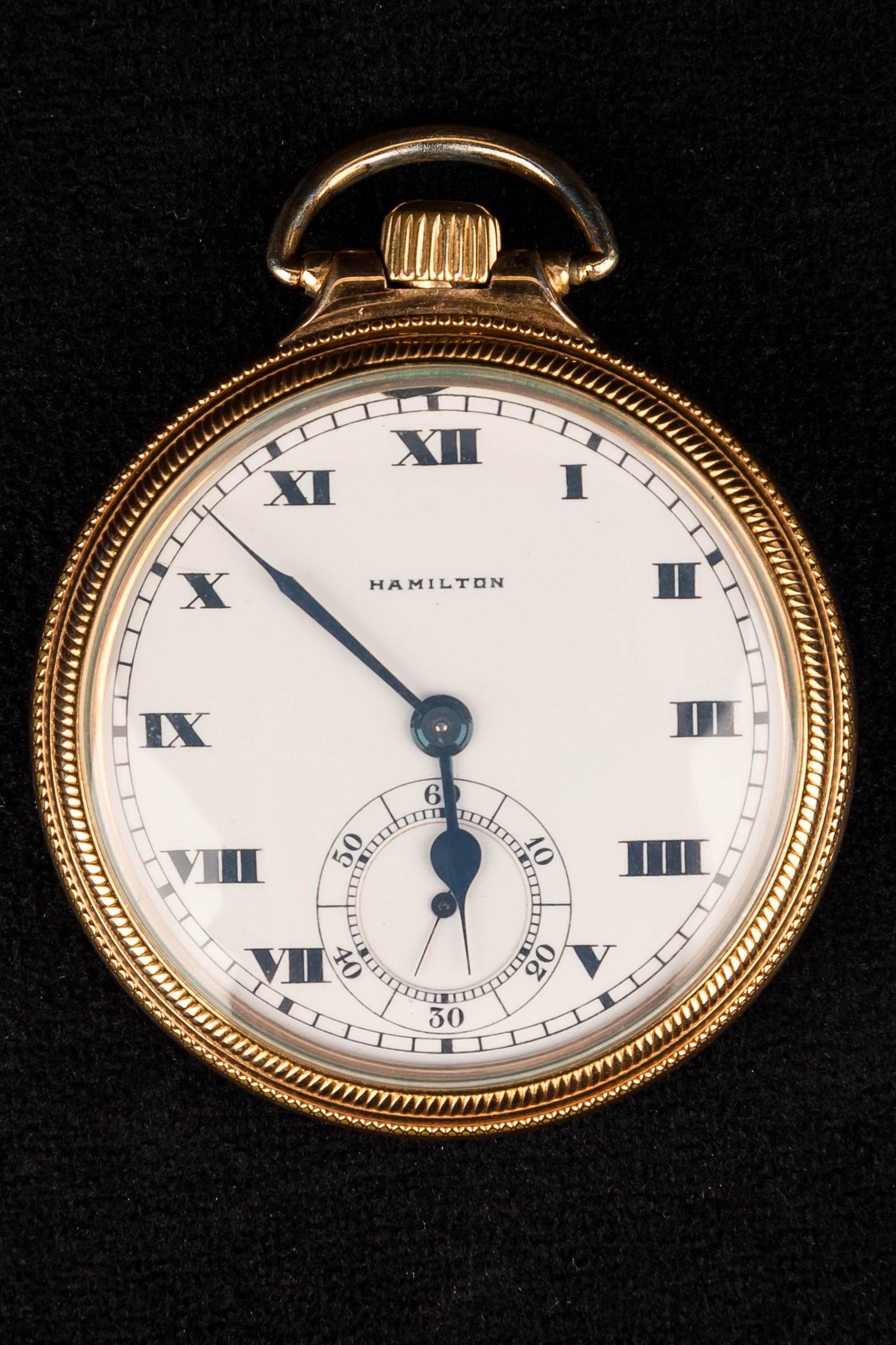 "Hamilton" Antique Pocketwatch: Signed "Hamilton" 956 17 jewel movement, white enamel face with roman numerals and second hand dial in gold case. In working order