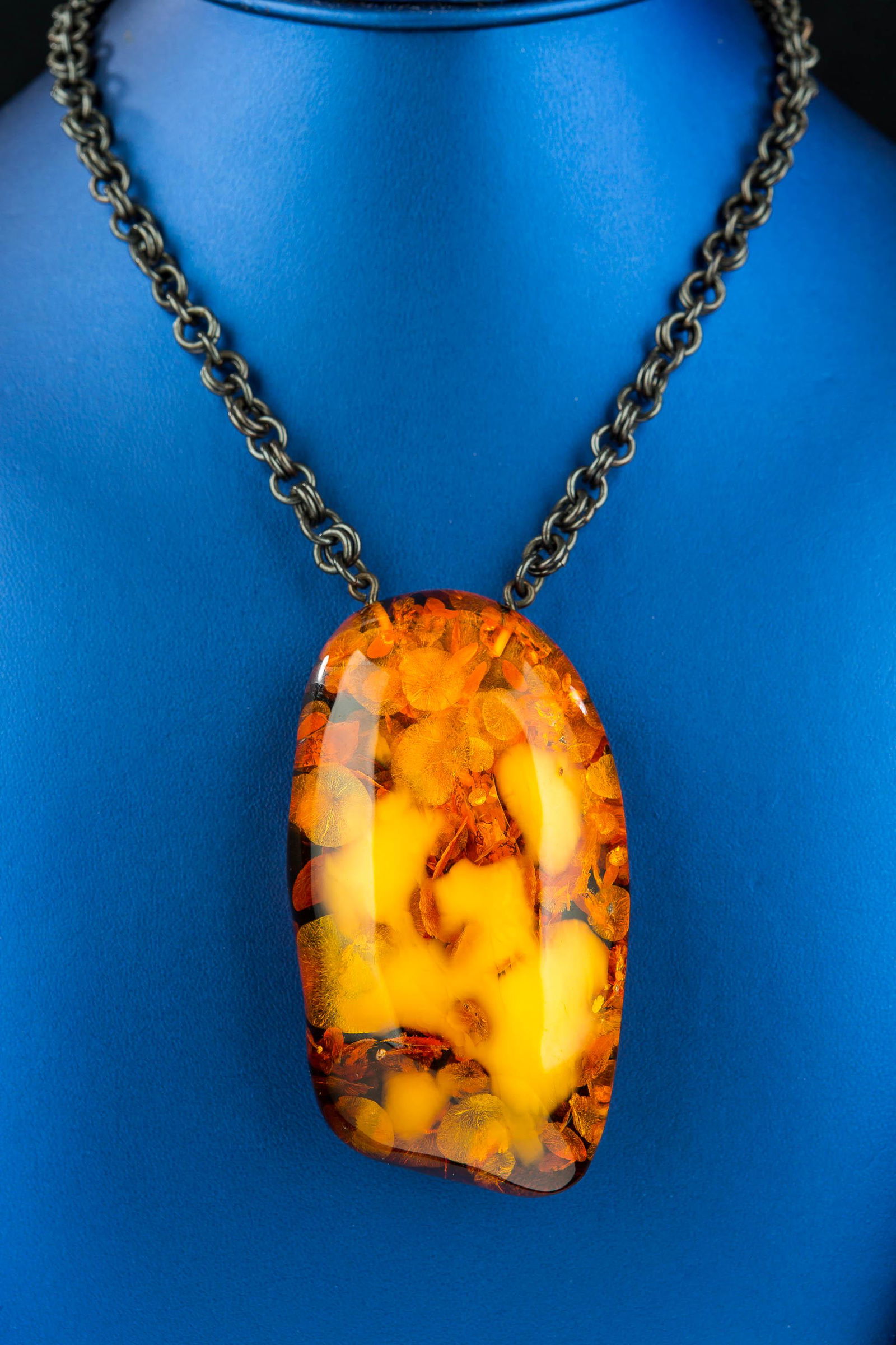 Rare Estate Baltic Amber Necklace: Large natural form amber pendant with its natural rough state in back. Gun metal long link chain necklace. Good color rare amber and highly included state. Over approximately 4 1/2" H and 3'W. Chain l