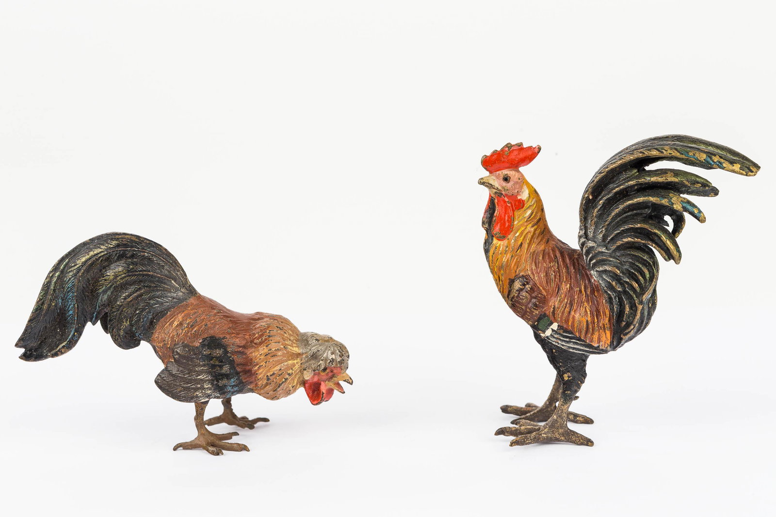 Austrian Cold Painted Bronze Roosters (2): The two (2) Austrian cold painted bronze roosters measure approx 3" tall. They are hand marked on the bottom (de-accession from a Franklin & Marshall College collection).