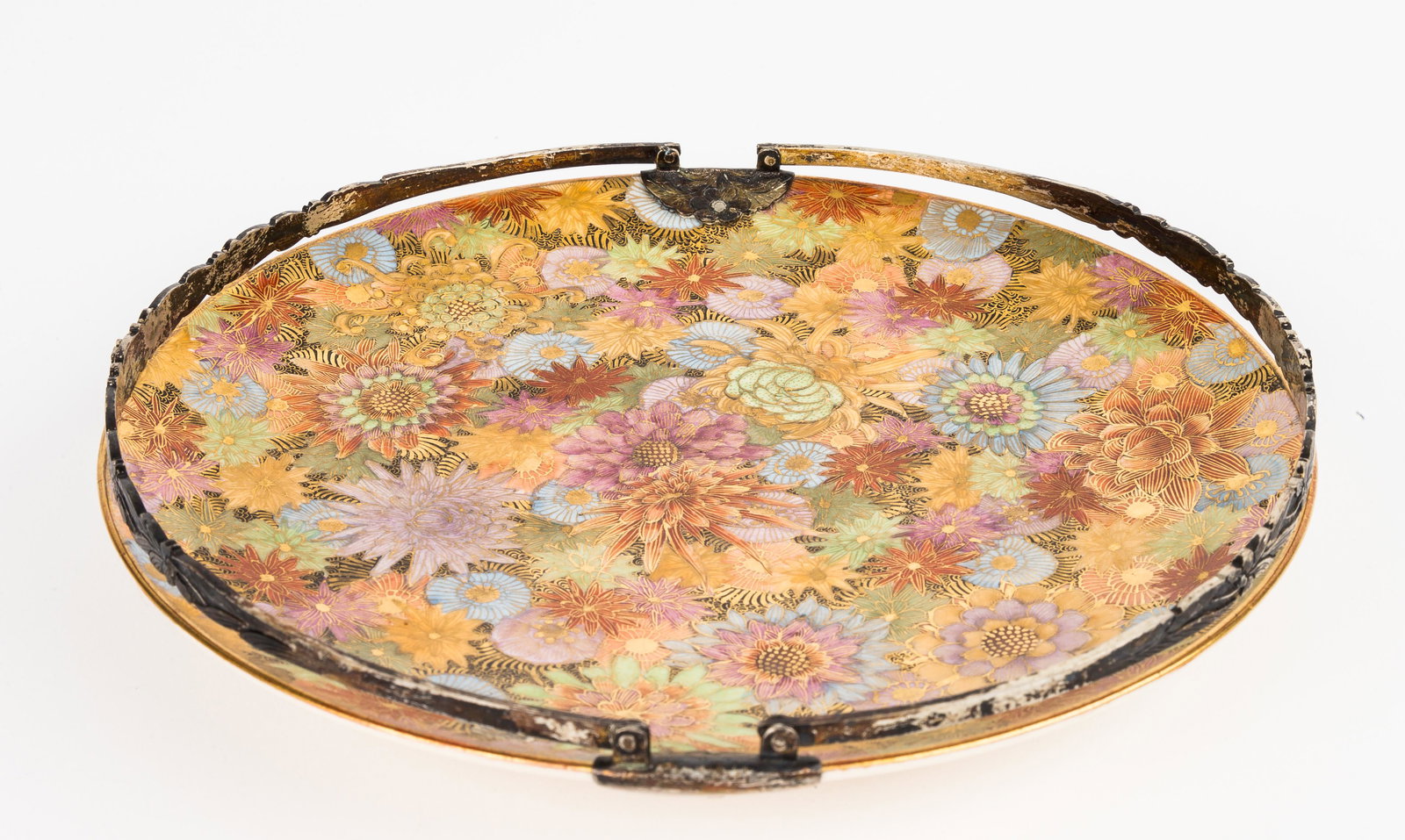 19th C Japanese Porcelain Basket: The 19th C Japanese porcelain basket has a floral design and gold accents and moveable handles. The basket measures approx 6.25"D x 3.5"H (with handles up / basket open). There are maker's marks on to