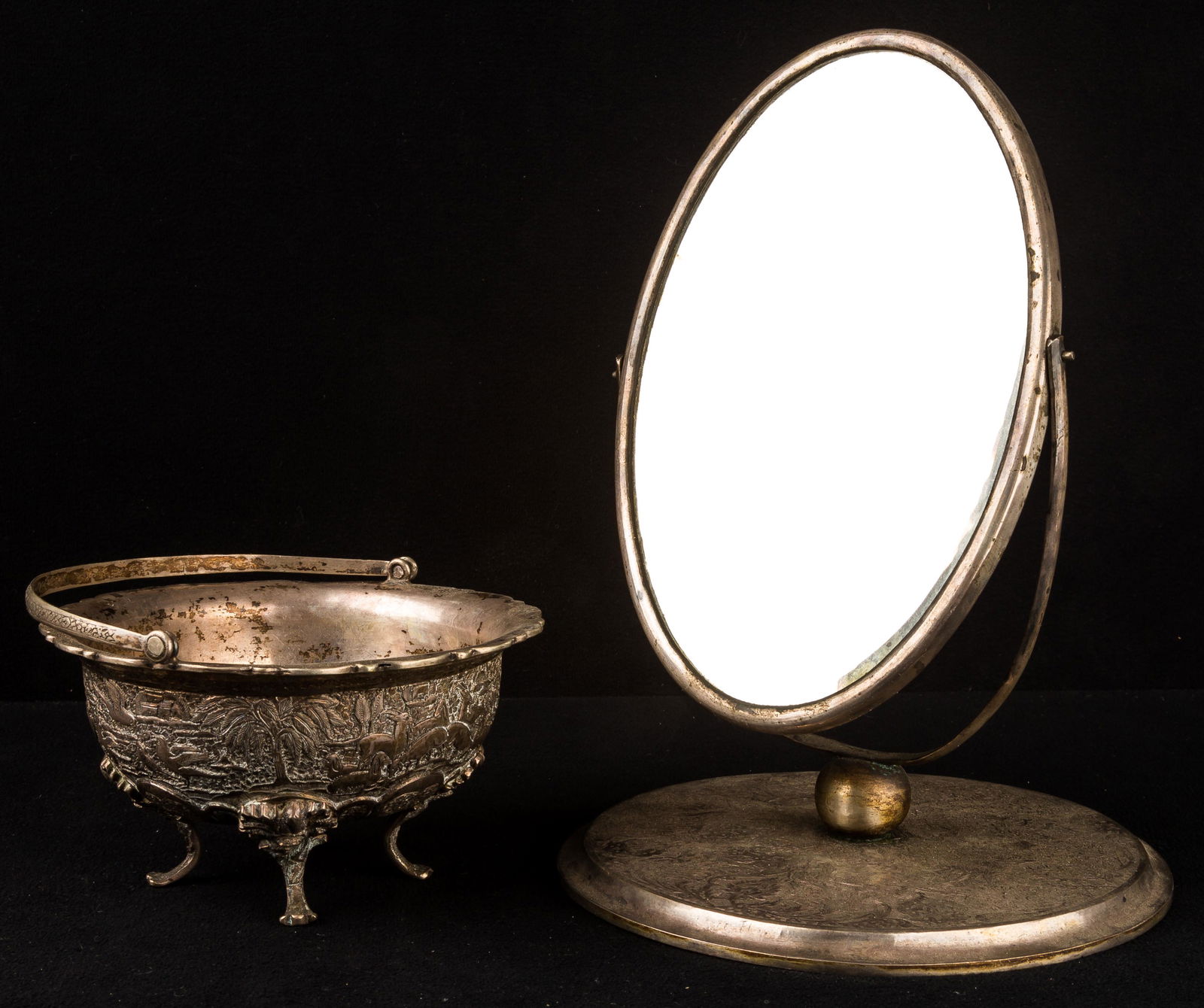 Persian Silver Mirror & Basket: There is one two-sided antique silver mirror and footed basket with a handle. Mirror at base is approx 5.5" D x 8" H and weighs approx 500g (with mirror). The basket measures approx 4.25" D and weighs
