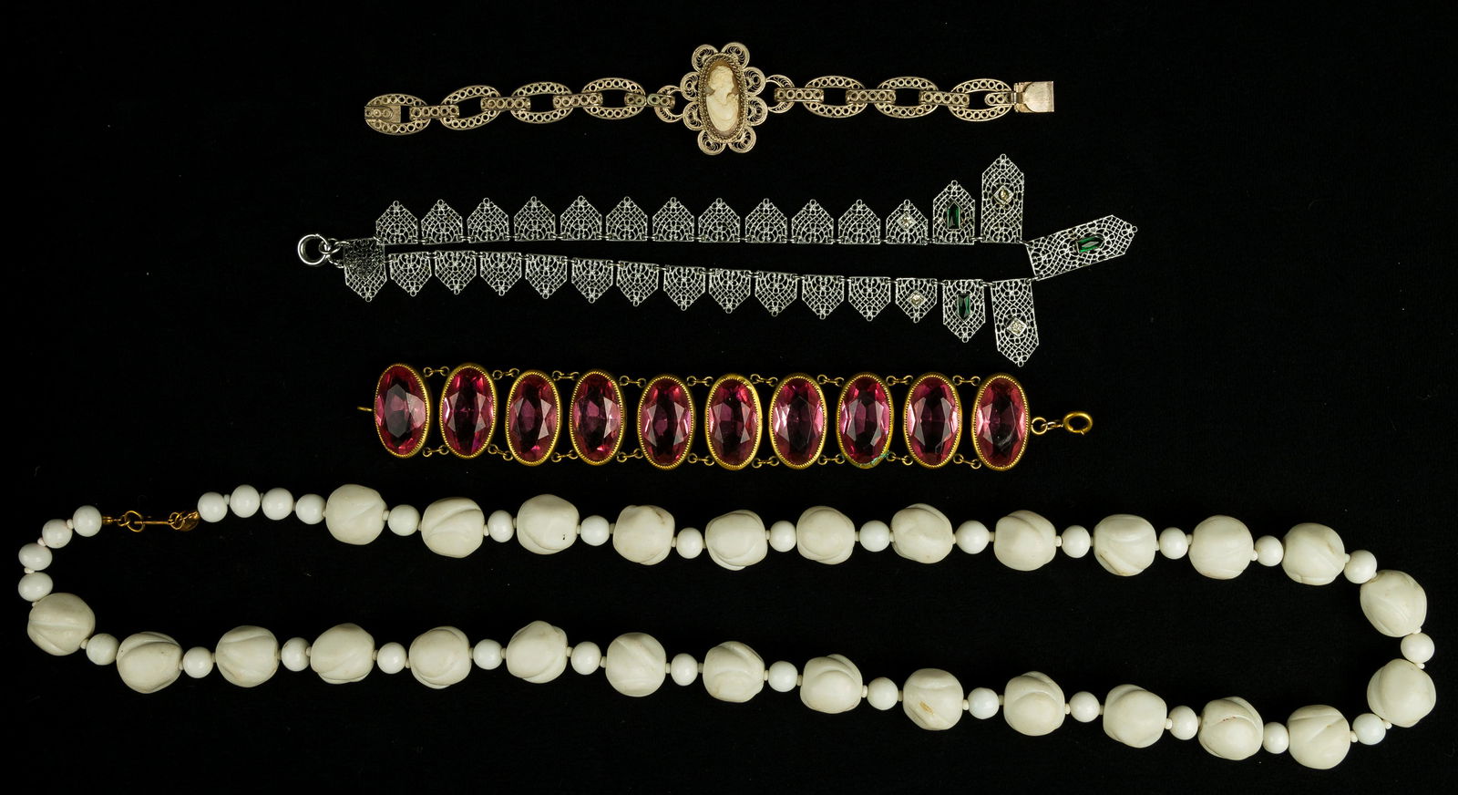 Miriam Haskell and Estate Vintage Jewelry: Signed "Miriam Haskell" with oval applied tag long white glass necklace, .800 silver cameo bracelet Circa 1940s pink glass bracelet and chrome necklace.