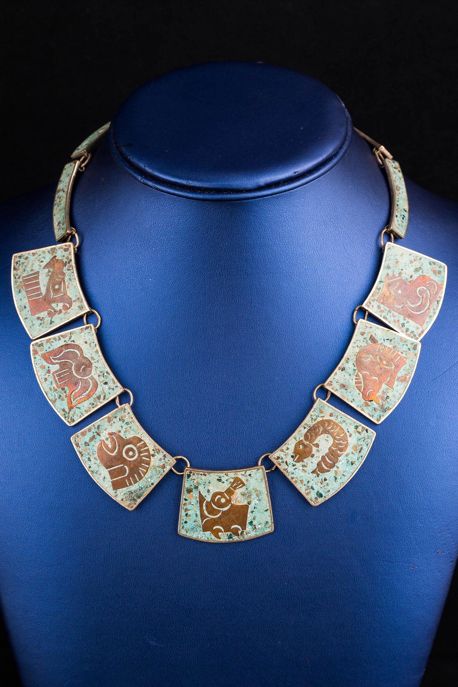 Vintage Mexican Sterling Necklace, Bracelet Set: Vintage Mexican Sterling Necklace, Bracelet Set. Signed Hecho En Mexico 925 matching paneled collar necklace and marching bracelet set with crushed turquoise and copper zodiac animal design/ inlay. Th