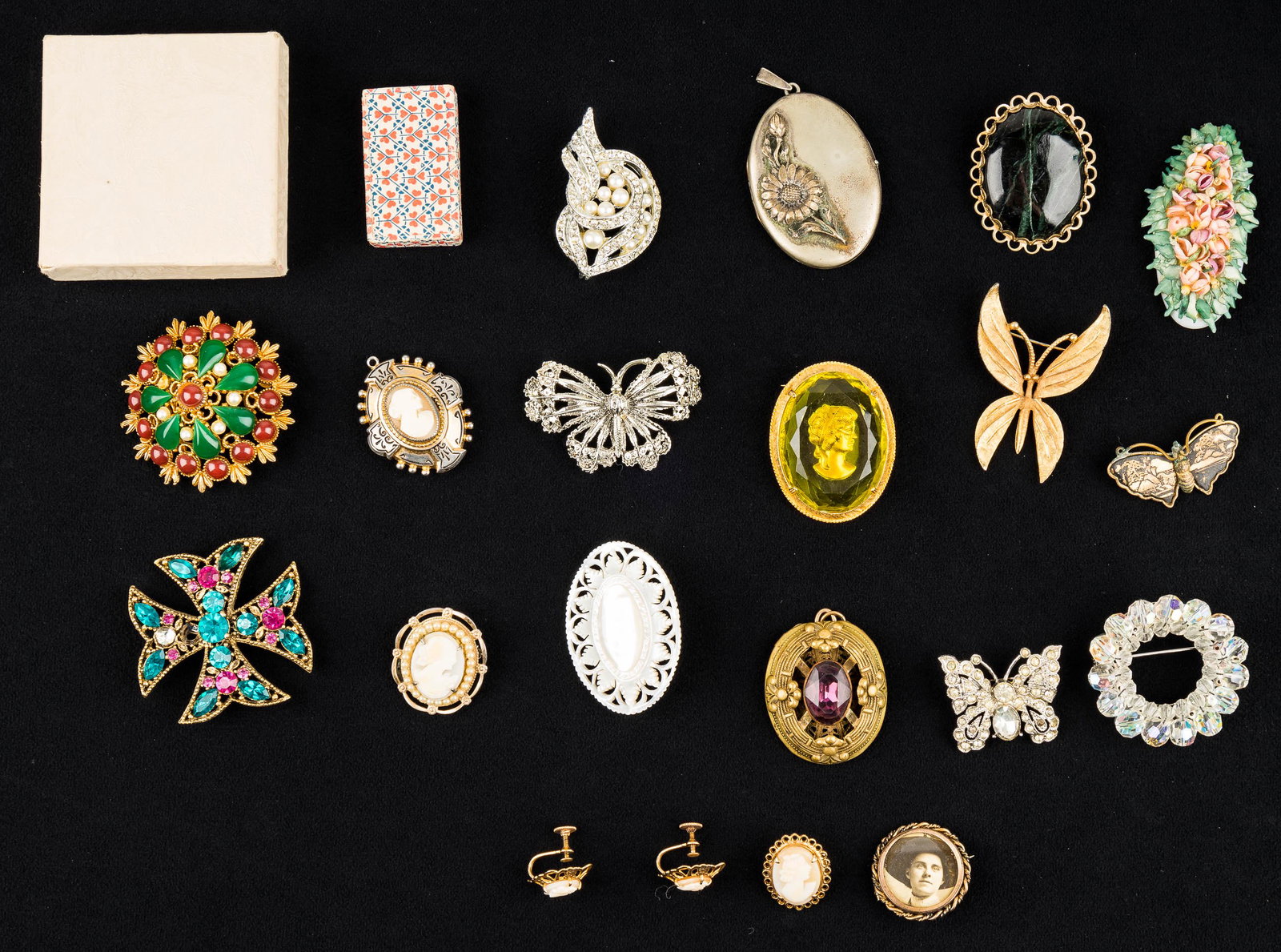 Hattie Carnegie and Vintage Jewelry: Signed "Hattie Carnegie" floral brooch (missing 1 small pearl - otherwise excellent condition), several shell cameo and butterfly brooches, art nouveau daisy alpaca locket and purple glass locket