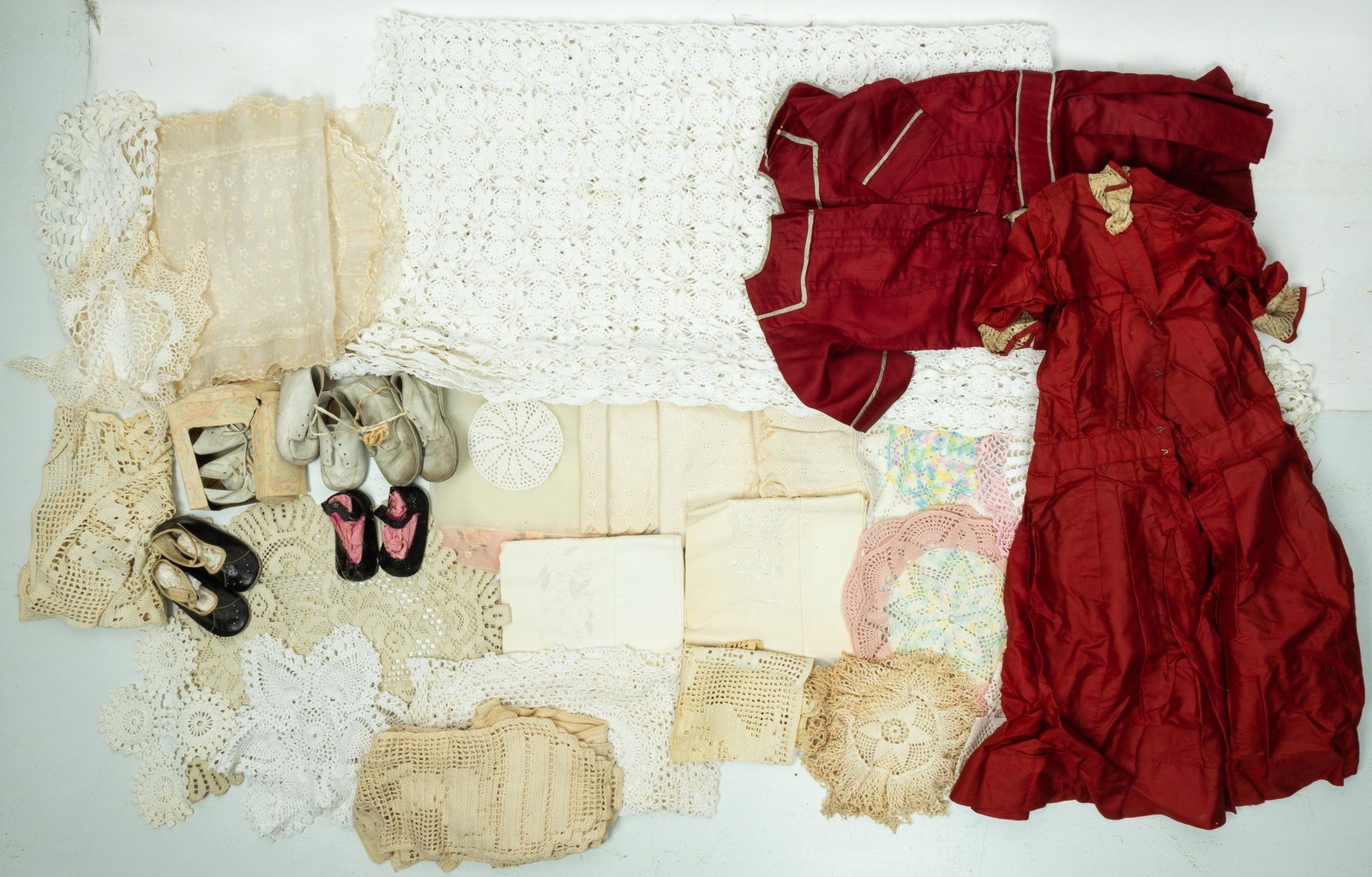 Doily Linens & Children's Clothes: Bed cover in doily construction measures approx. 84" x 74" in area. Also includes 25 other dollie table runners, pot holders, etc. Other linens include a pair of long table runners, a pair of pillow c