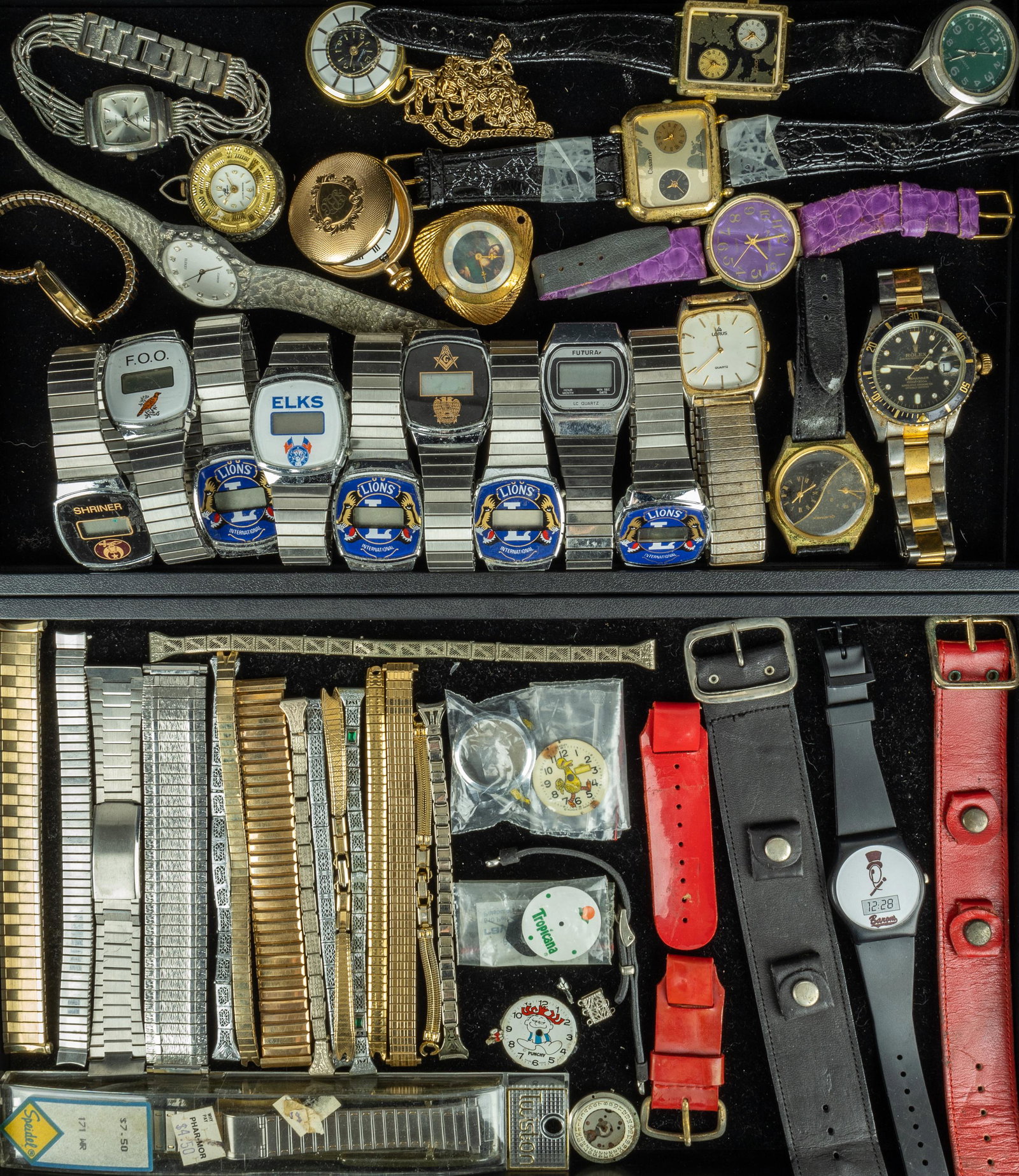 2 Trays of Watches and Watch Parts: Wrist watches include 8 Fraternal Order related wrist watches, 3 dual time zone wristwatches, 4 Ladies Designer style wristwatches, and 3 others with fake Rolex submariner steel watch. There are 3 Wri