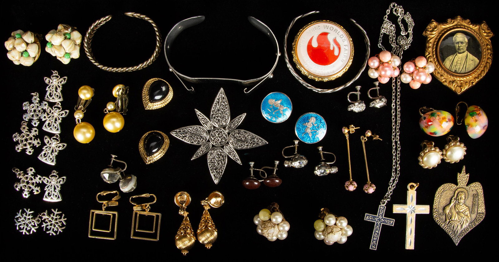 Siam Sterling & Costume Jewelry: Lot of over 25 items featuring Siam sterling clip earrings (some enamel loss on one), vintage clip earrings, religious pieces, a John hardy clip, and more.