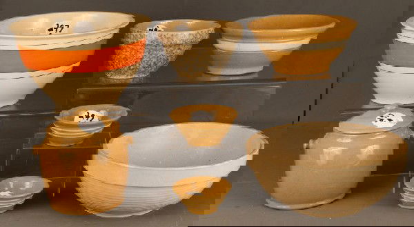 Pottery and Yelloware: 7 pcs potery & yelloware bowls including cookie jar w/lid, large orange banded bowl, white band bowl of varying sizes plus others