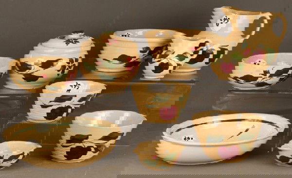 Watt Pottery: 10 pcs Watt Pottery including 2 nesting bowls, pitcher and creamer of the apple design; cookie jar, spagetti bowl and 3 othe bowls floral design