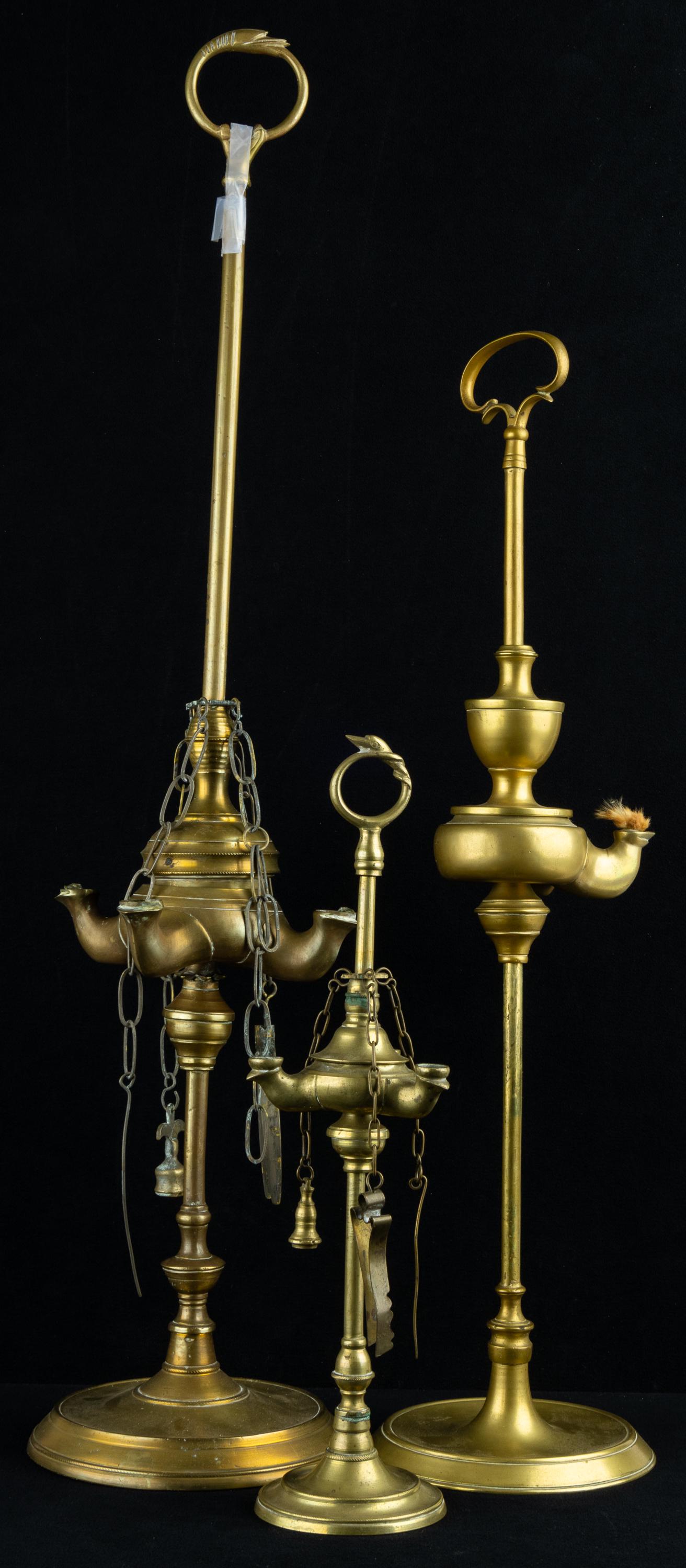 Antique Persian Oil Lamp Collection: Brass oil lamps with accessories, tallest approx 25"H.